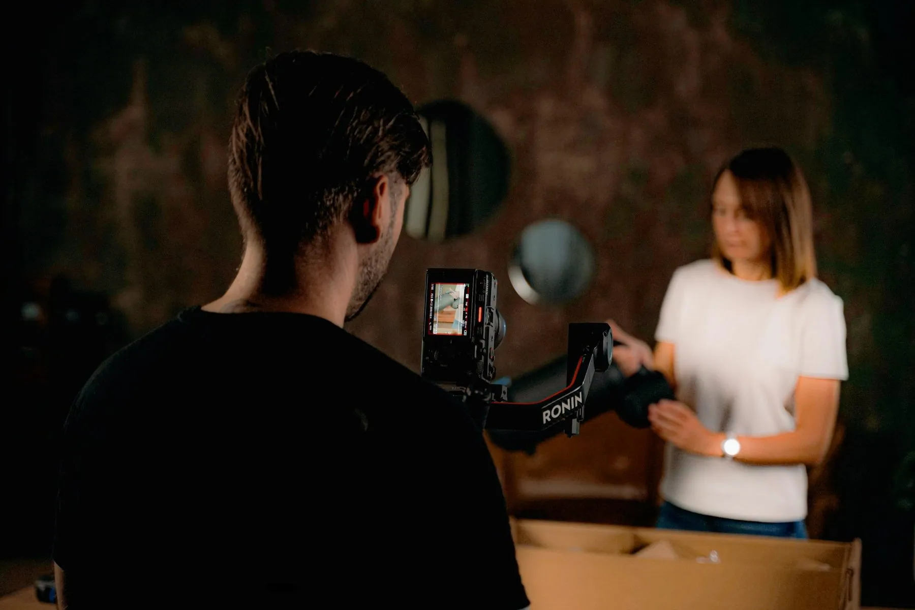 Filming a woman with a camera and gimbal rig