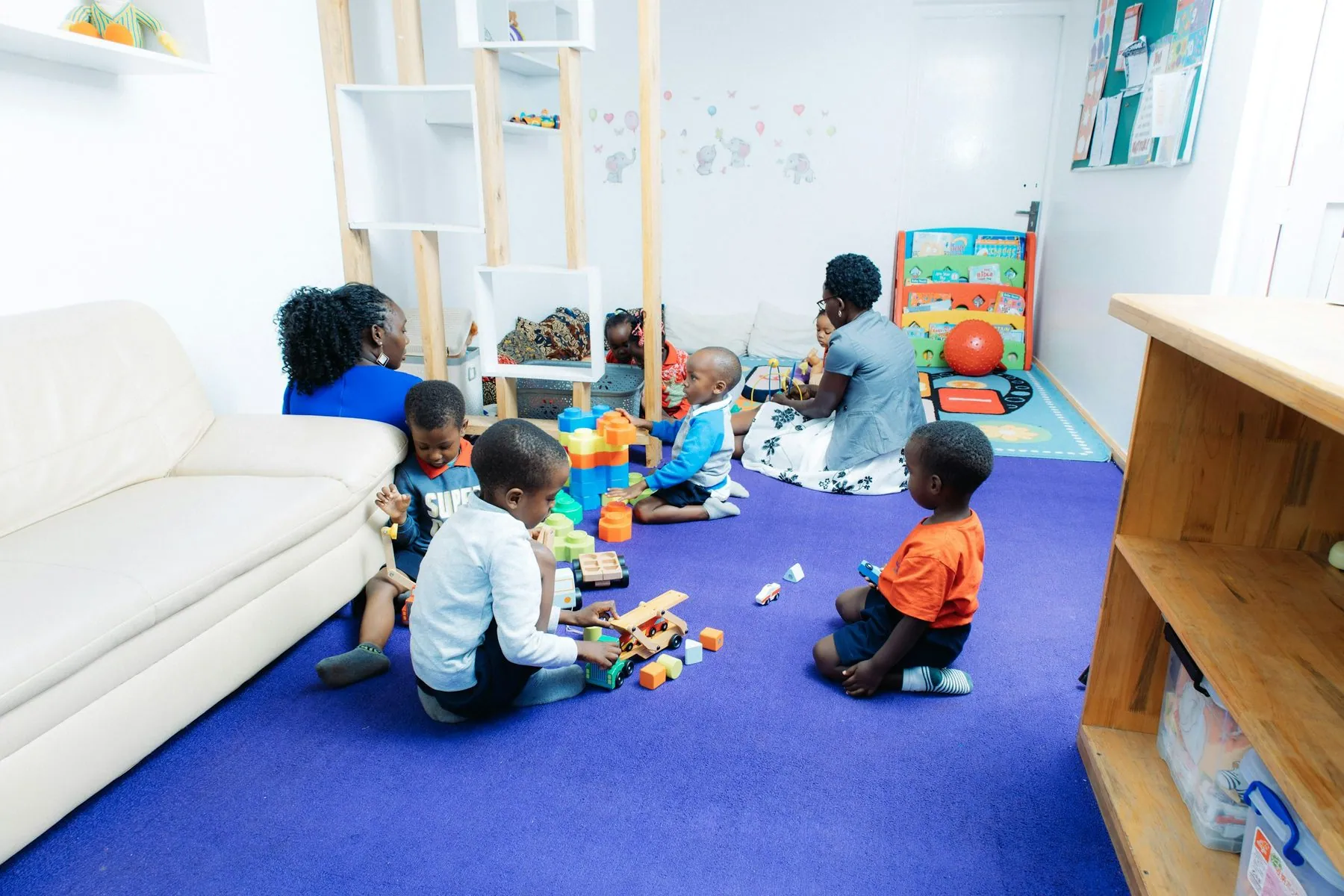 Children playing with toys in a bright room