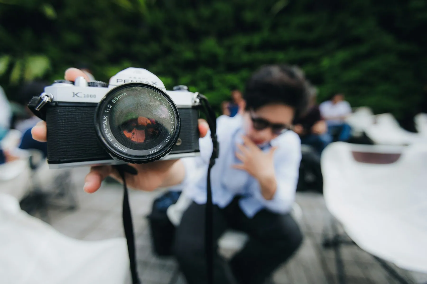 A person taking a picture with a camera